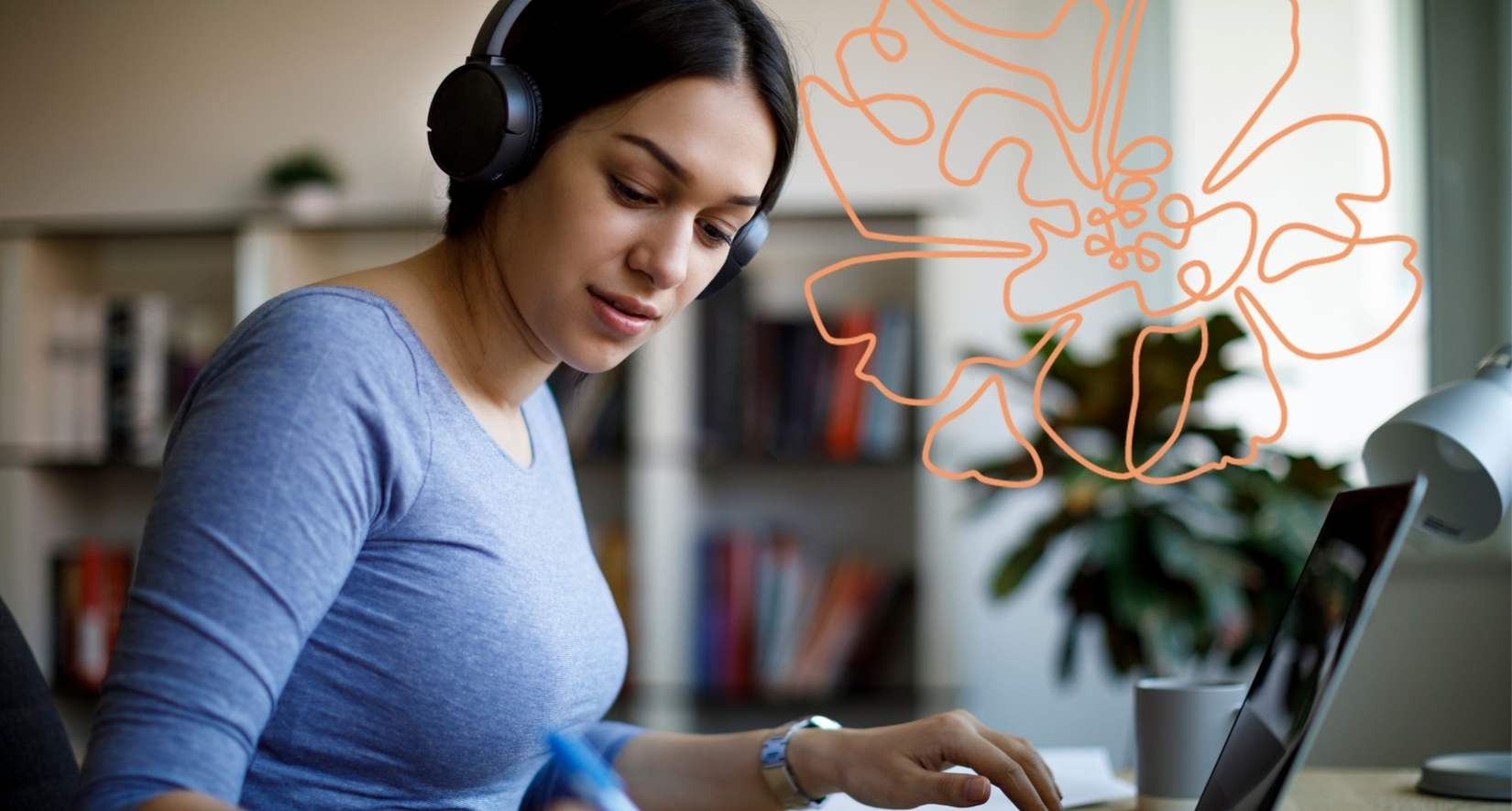 Young woman with head phones working at a desk